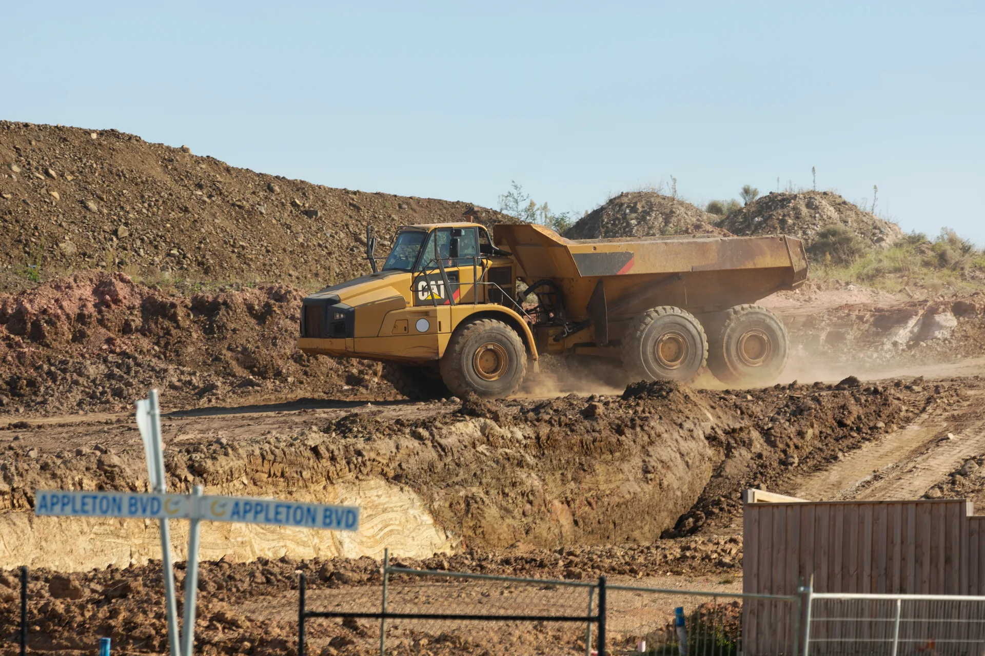 Dump trucks and heavy equipment on a job site